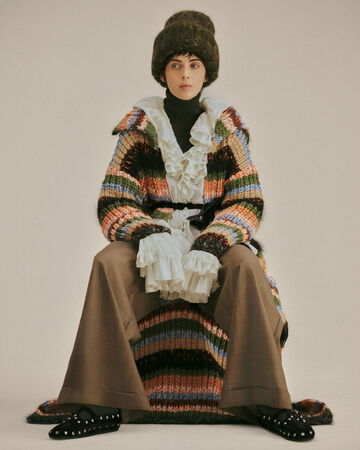 Model wearing striped knit and beanie from the Fall/Winter 2026 collection